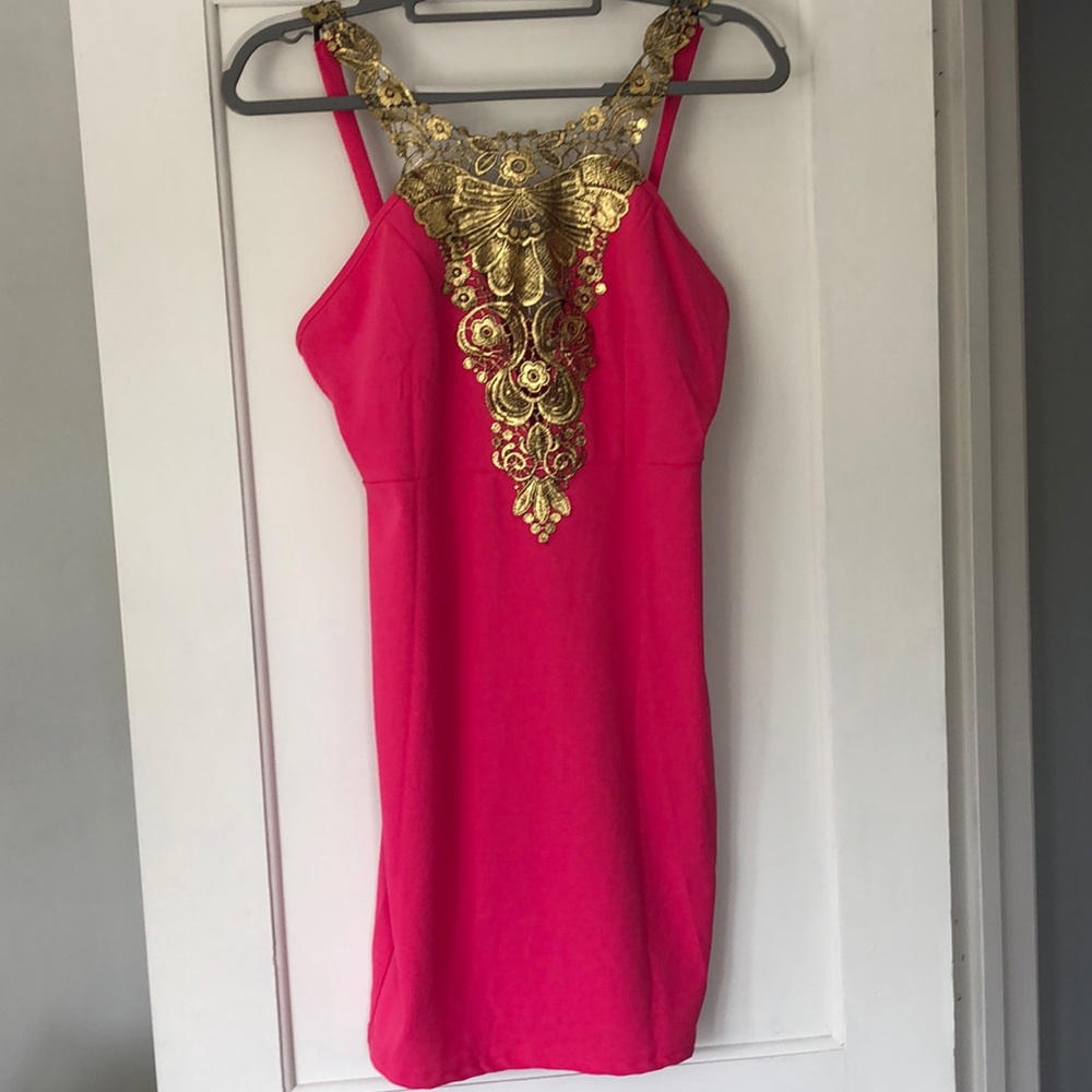 SAFIRA based in London large, embellished dress,‎ hot pink. Polyester,spandex.